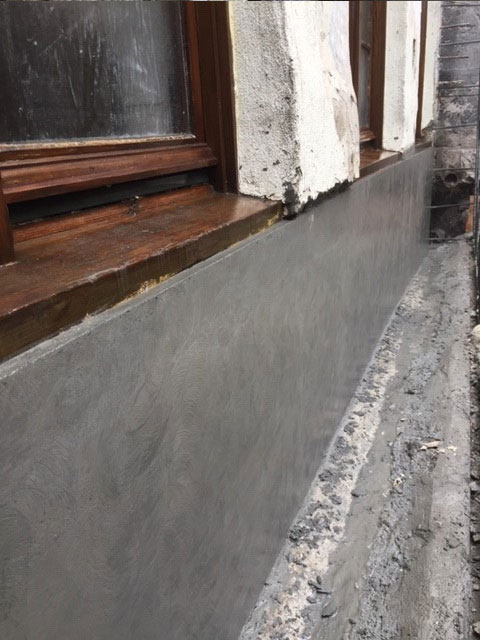 Foundation concrete resurfacing ready for waterproofing