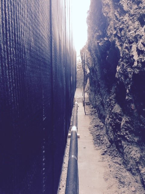 Drainage panels protecting foundation waterproofing