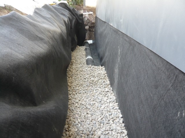 Filter fabric installed under french drain prior to applying gravel