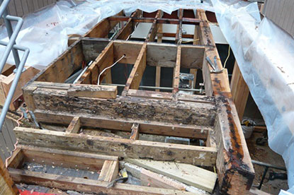 Courtyard deck leaks creating structural termite damage