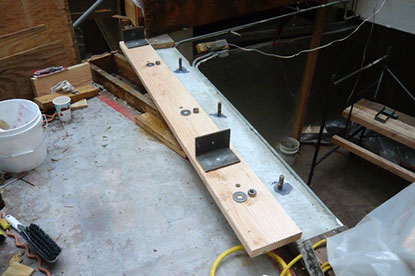 Structural courtyard deck bolt downs as required by building codes