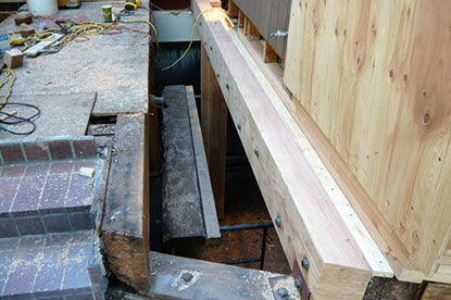 Sister structural beam bolted to support existing termite damaged beam