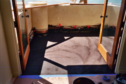 Balcony sloping mortar bed applied over under tile waterproofing